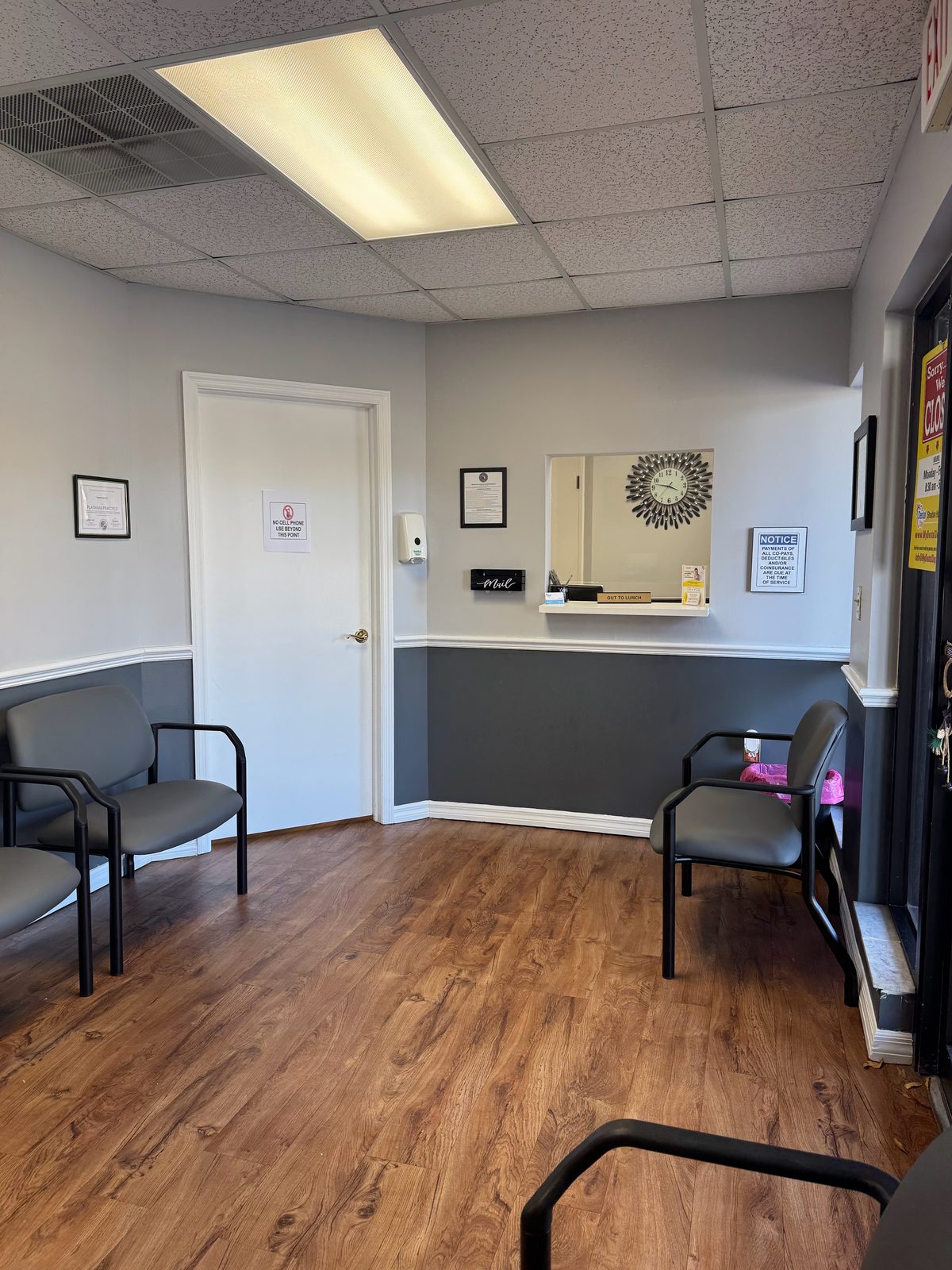 Dental Day waiting room and front-desk check-in window in Brandon, FL